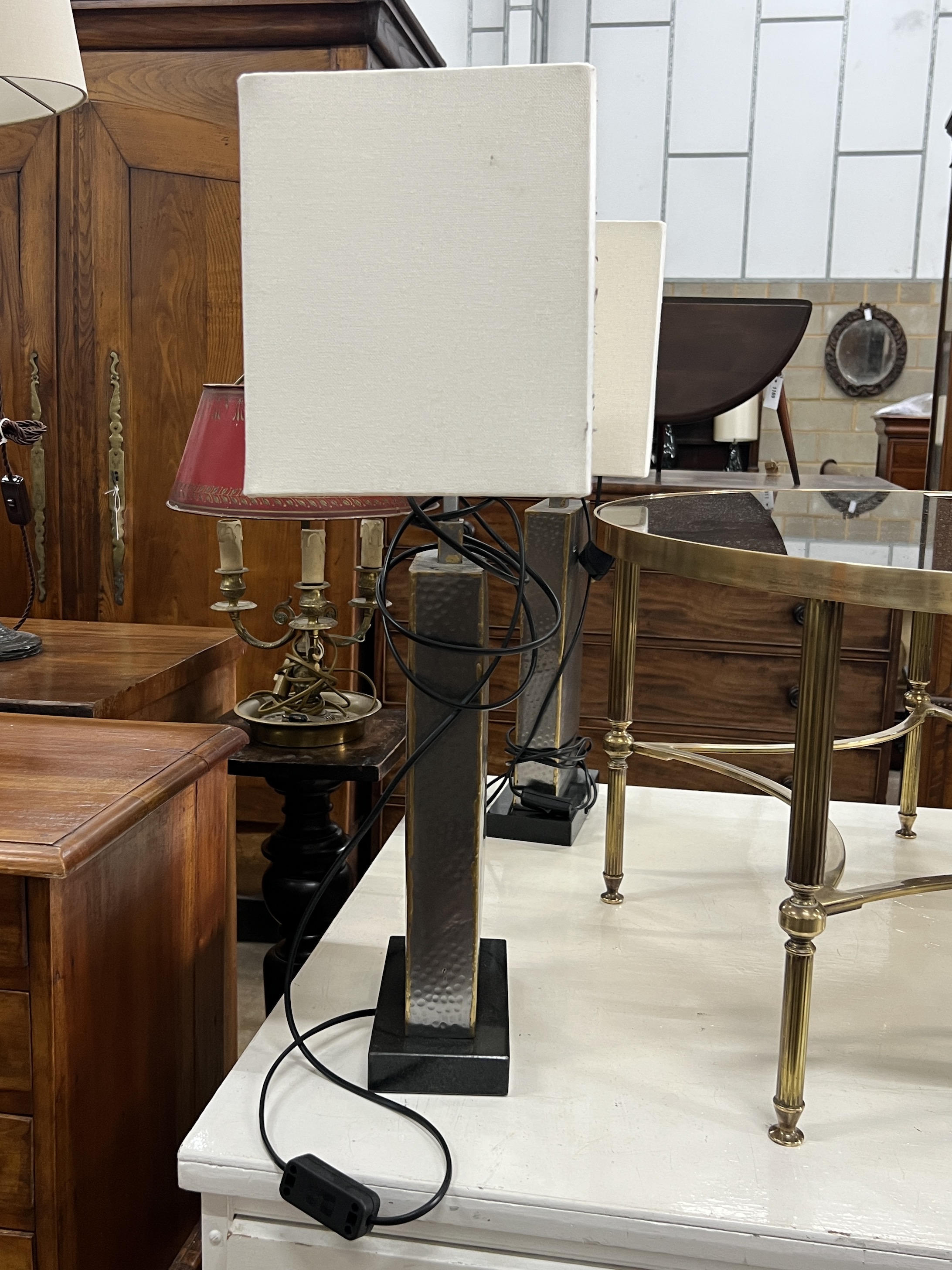 A set of four contemporary planished metal table lamps and shades, height including shades 70cm